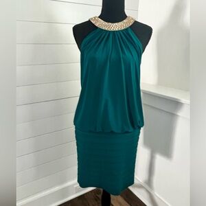 Classy cocktail dress, draped bodice horizontal pleats, jeweled halter neckline.